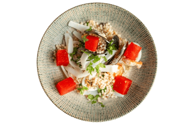 Seafood salad with fregola sarda and melon